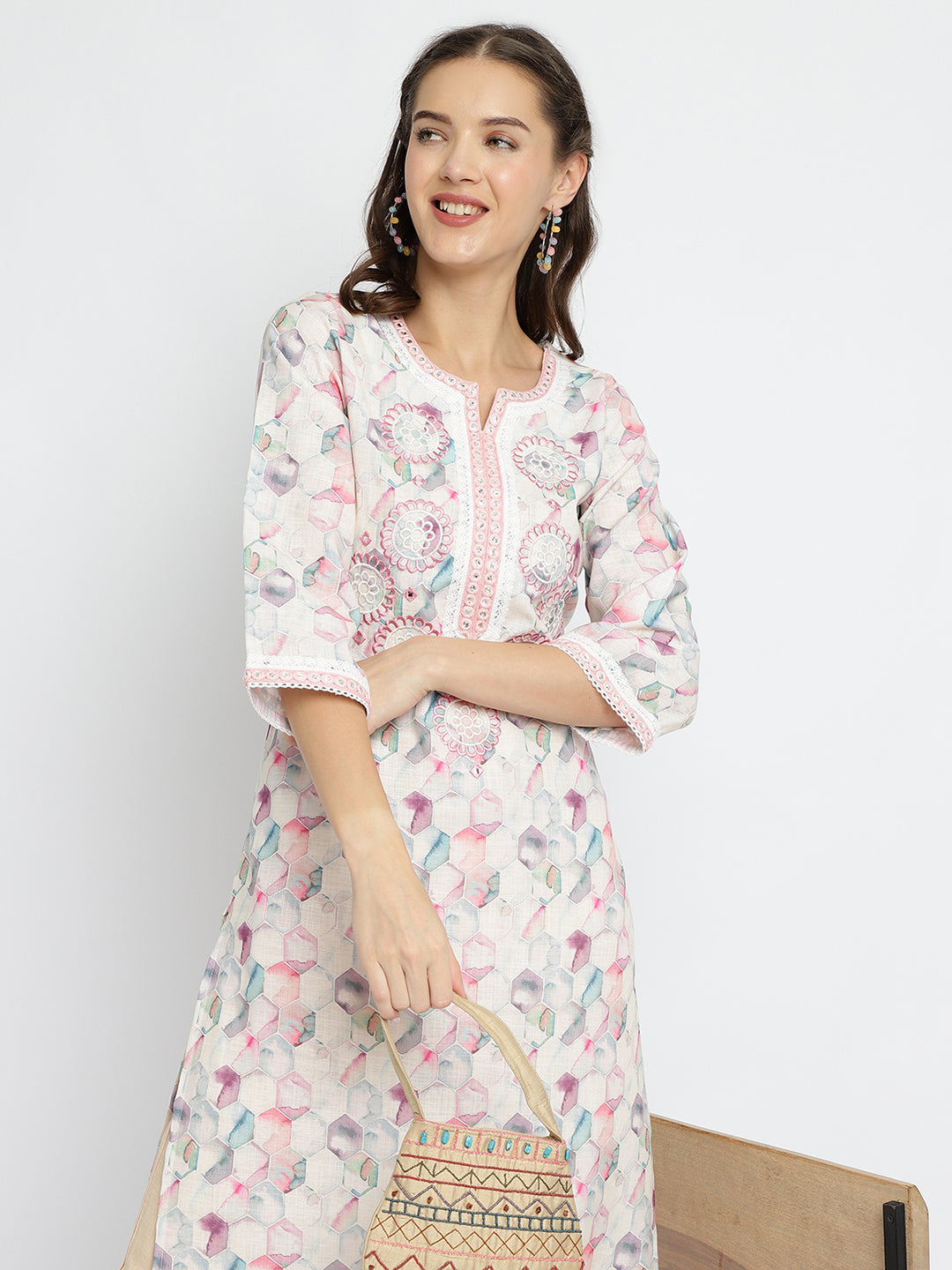Women Off White geometrical printed embroidered kurta.