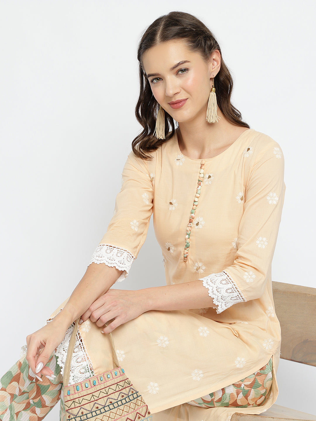 Women Peach Embroidered Kurta with Printed Pant .