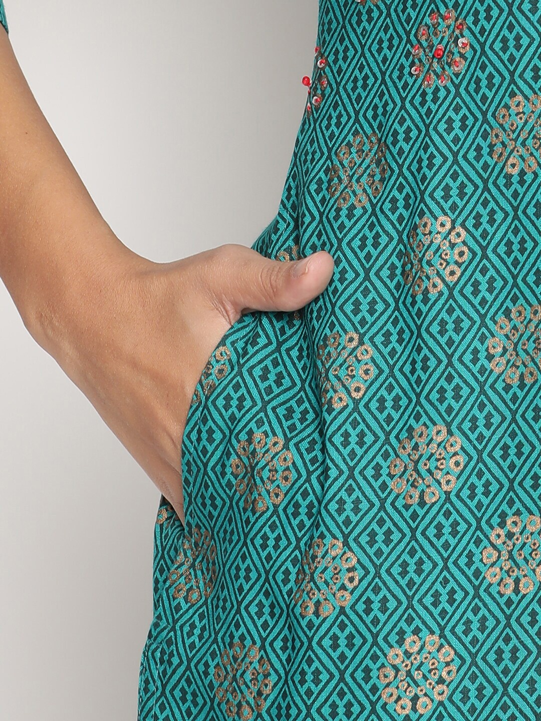 Women teal green golden printed straight kurta With pant